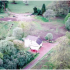 The Dairy / Gardener’s Cottage was extended as a residence after Milton Lockhart House was abandoned and subsequently removed. The disturbed ground in this photo of the 1990s is the site of both the old (removed) Milton Lockhart House and the current Lockhart Castle.